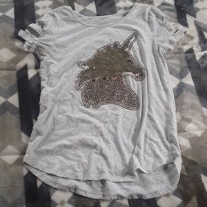 A shirt that has a flip sequin unicorn.
